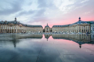 Place de la Bourse and Miroir d'eau in Bordeaux, with sky reflections in the foreground.