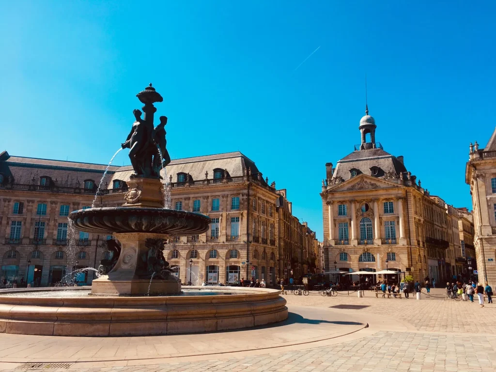 View of Place de la Bourse and its fountain in Bordeaux by sunny weather