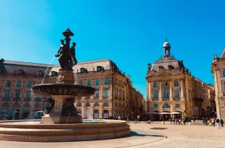 View of Place de la Bourse and its fountain in Bordeaux by sunny weather