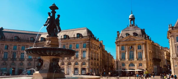 View of Place de la Bourse and its fountain in Bordeaux by sunny weather