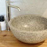 Natural stone vanity in the luxury ensuite bathroom at Numa House near Bordeaux